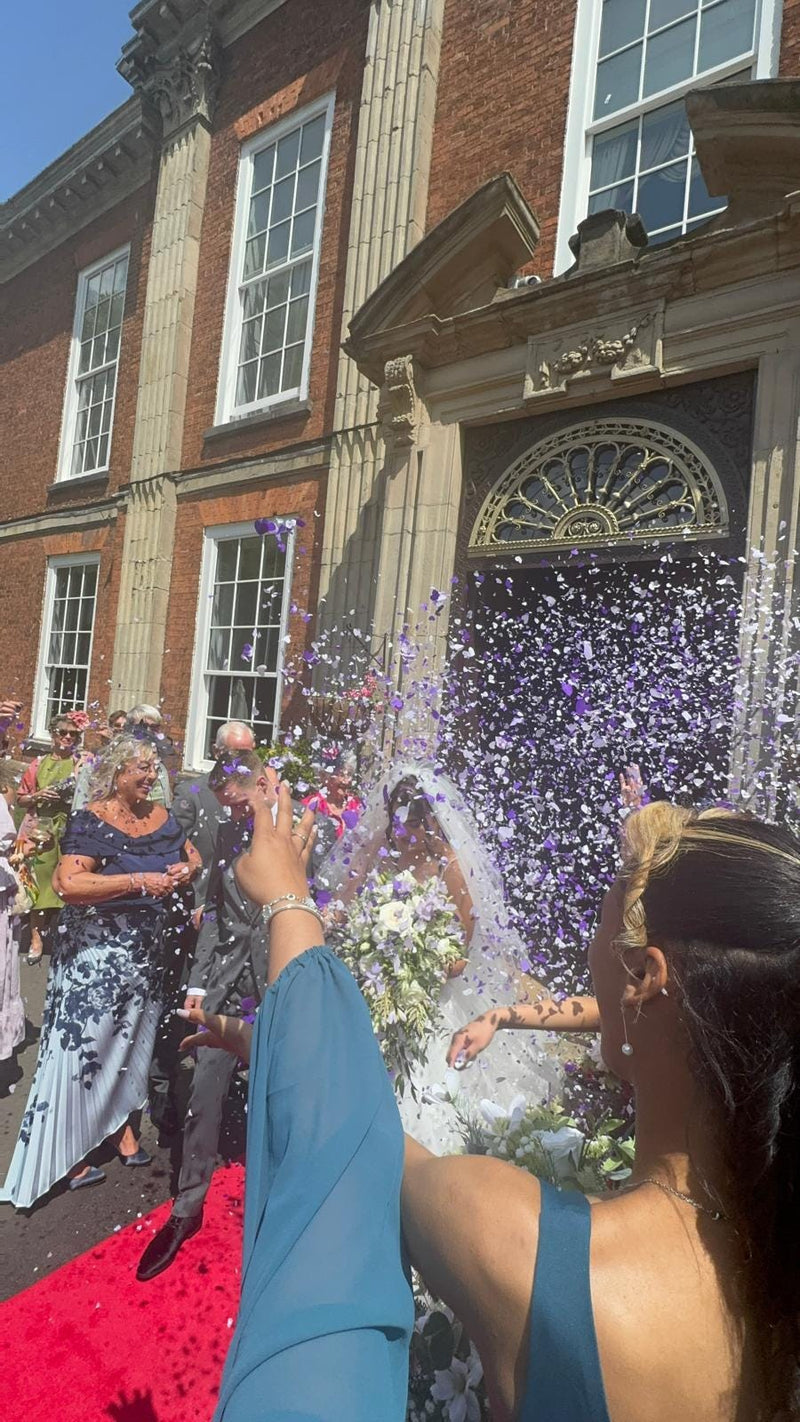Heart confetti thrown at a customer celebration