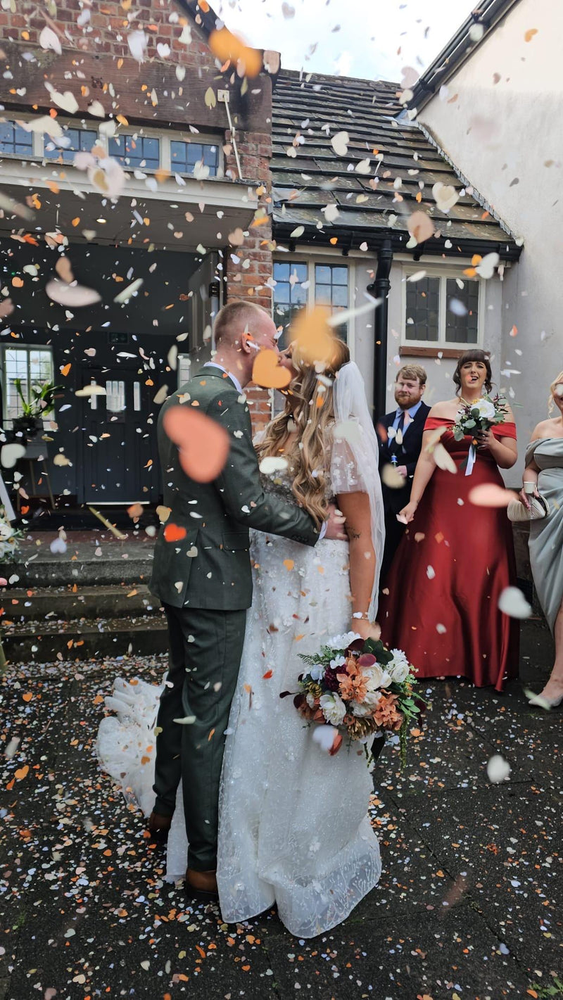 Heart confetti thrown at a customer celebration