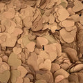 A dense pile of small heart-shaped paper confetti in warm metallic brown shades.