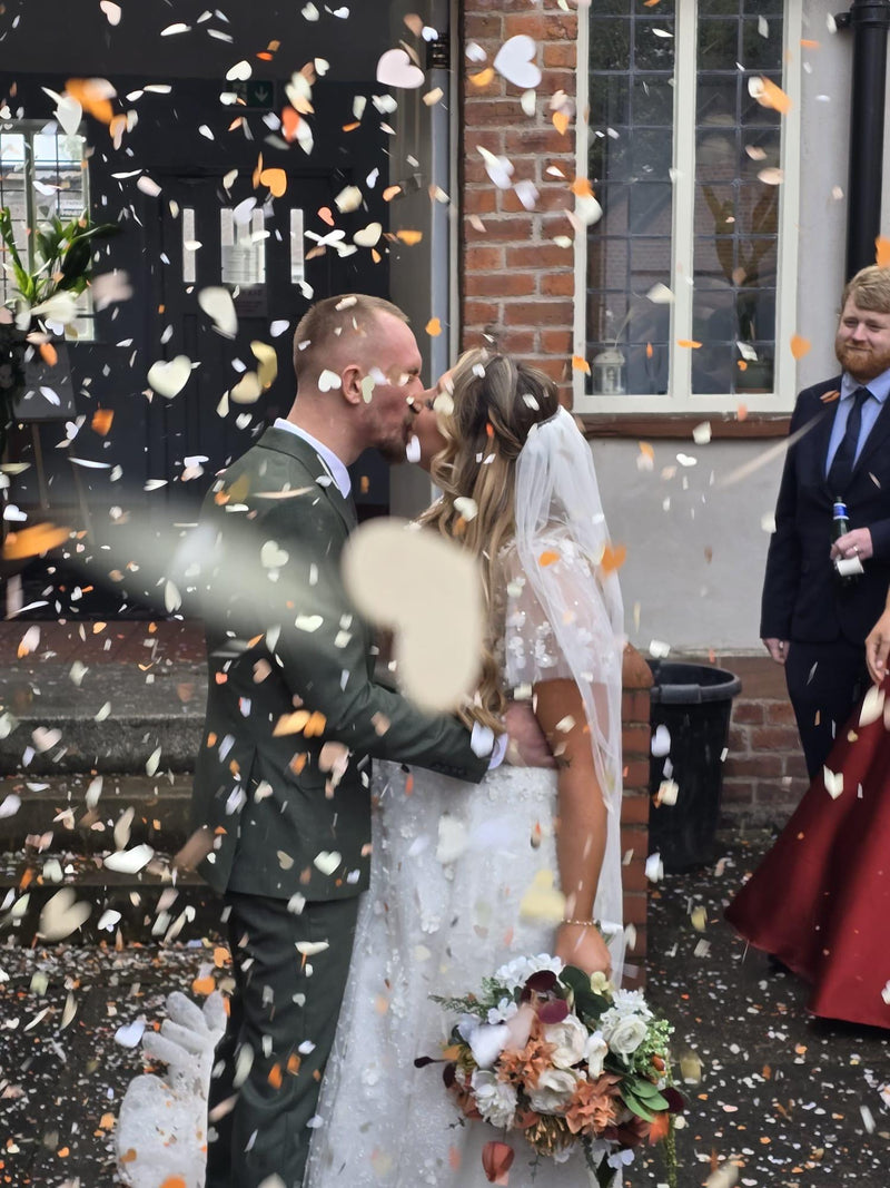 Heart confetti thrown at a customer celebration